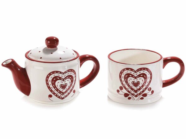 Teiera e tazza in ceramica con decori a cuore in rilievo  Misure: cm 17 x 9,5 x 17,5 H