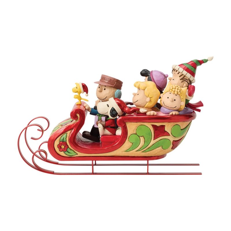 statuetta di snoopy e amici sulla slitta peanuts di jim shore