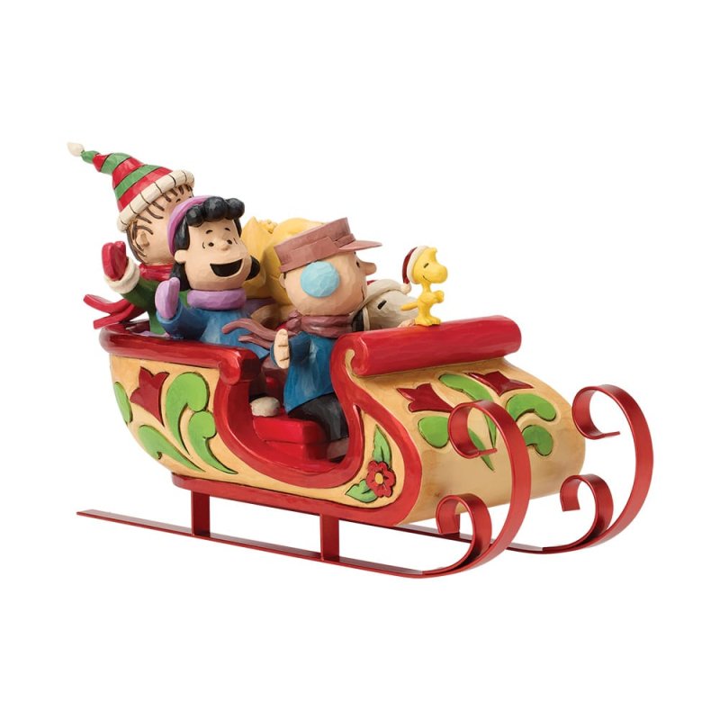 statuetta di snoopy e amici sulla slitta peanuts di jim shore