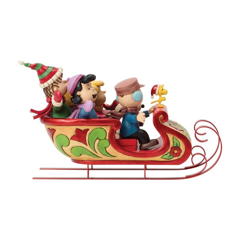 statuetta di snoopy e amici sulla slitta peanuts di jim shore